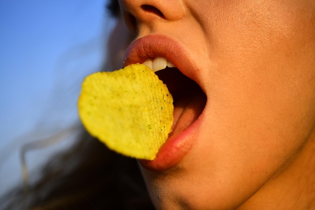 female-mouth-eat-potato-chips-chips-with