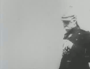 Bismarck removing his helmet