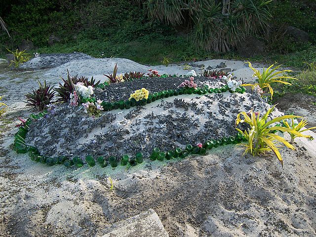 Tonga grave coral bottles