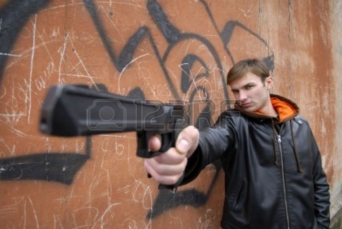2147199-young-guy-with-pistol-in-hand-on