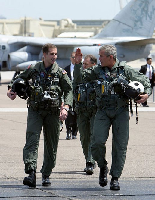 George W. Bush walks with Ryan Phillips 