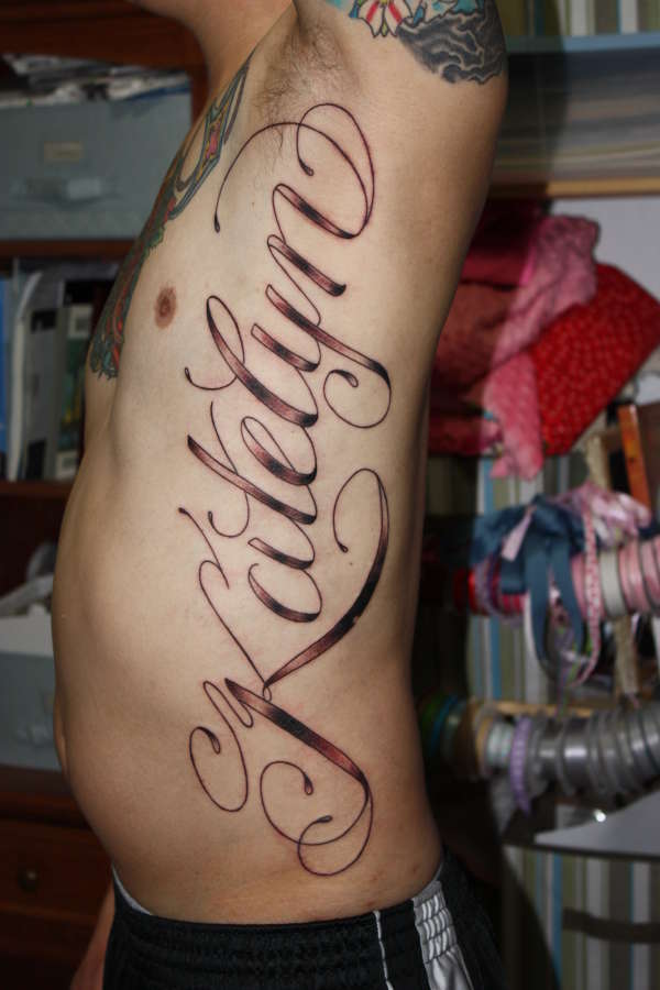 tattoos ideas for names. rib tattoo ideas for guys. rib tattoo idea