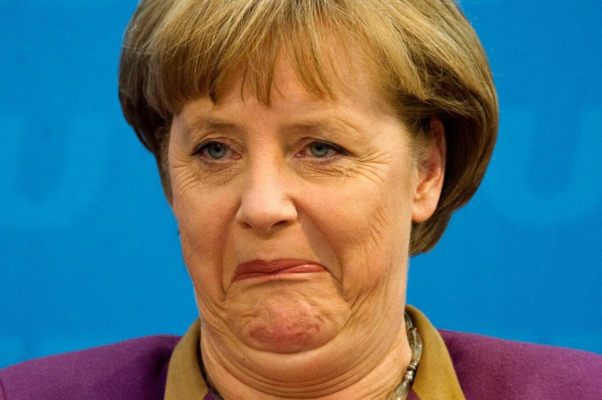 Angela-Merkel-grimaces-as-she-addresses-