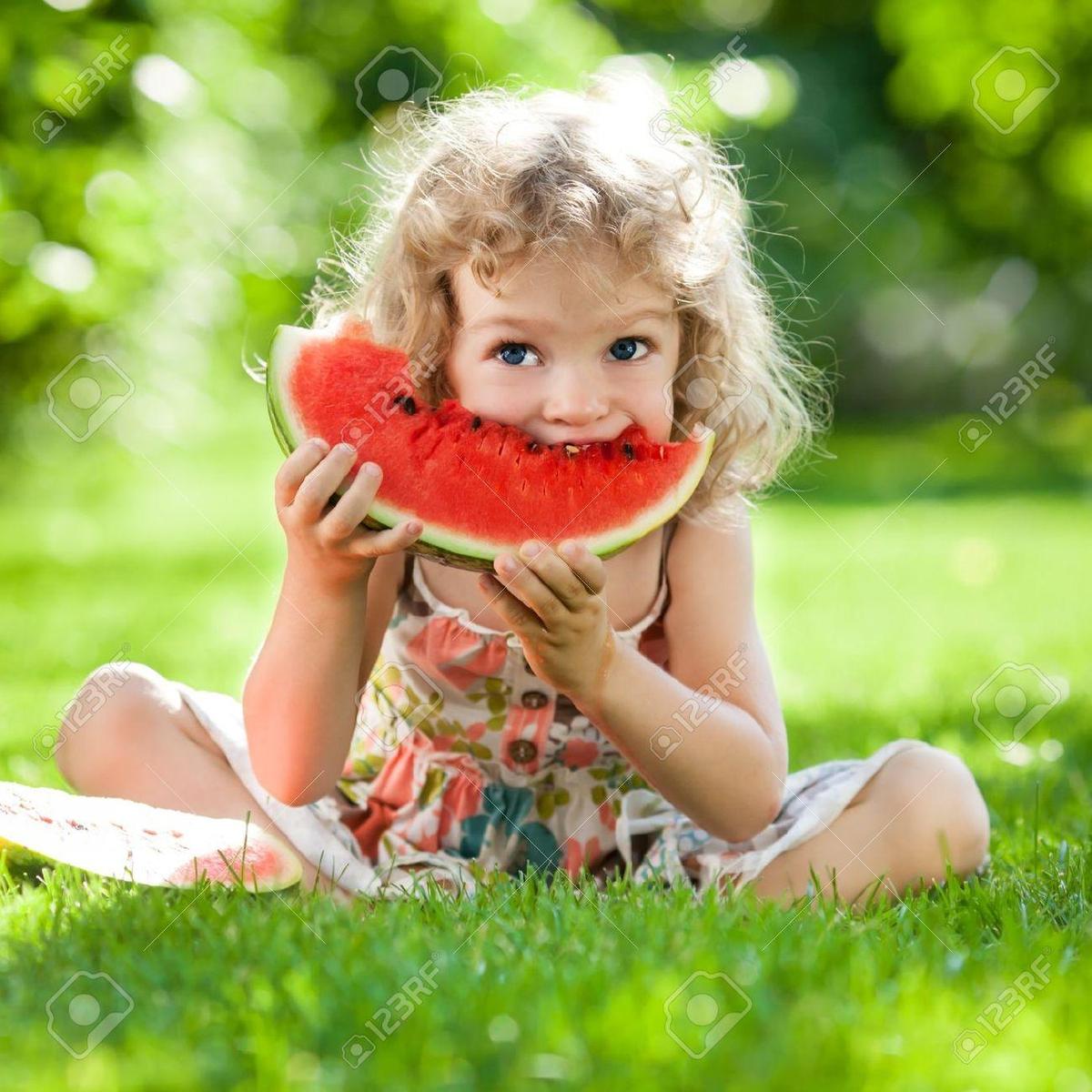 18394776-Happy-child-with-big-red-slice-
