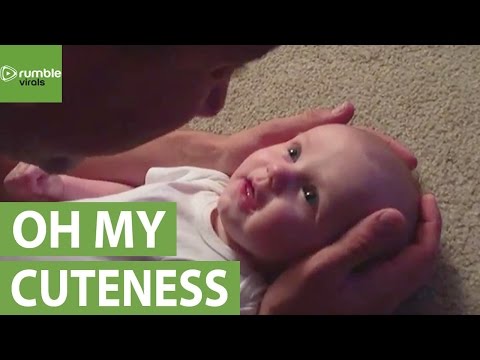 Youtube: Baby girl has emotional reaction to daddy's singing