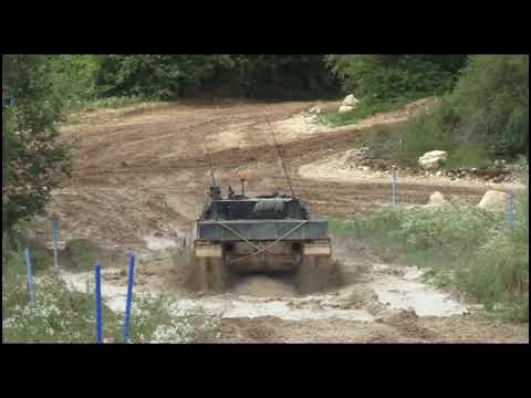 Youtube: Swiss Leopard 2 driving trough Mud (slow Motion)