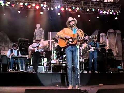 Youtube: Alan Jackson - Here In the Real World (Live at Farm Aid 1990)