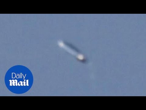 Youtube: Photographer captures 'pill-shaped' UFO in the sky!!