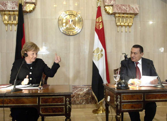 /dateien/70138,1296445332,11-merkel-und-mubarak-fordern-gesmtplan-fuer-den-nahen-ostenpropertyposter