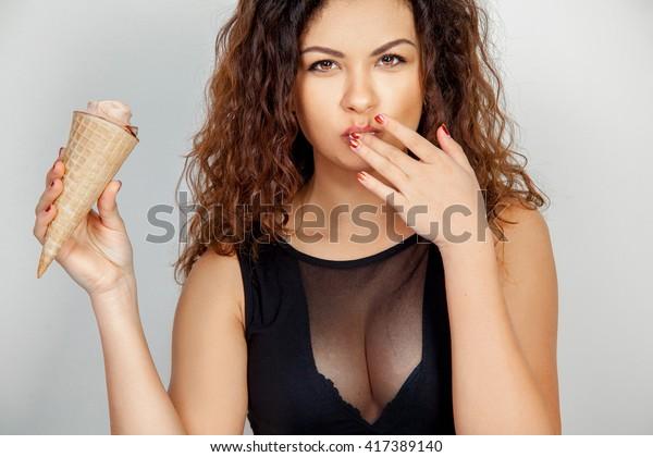 sexy-girl-eats-ice-cream-600w-417389140