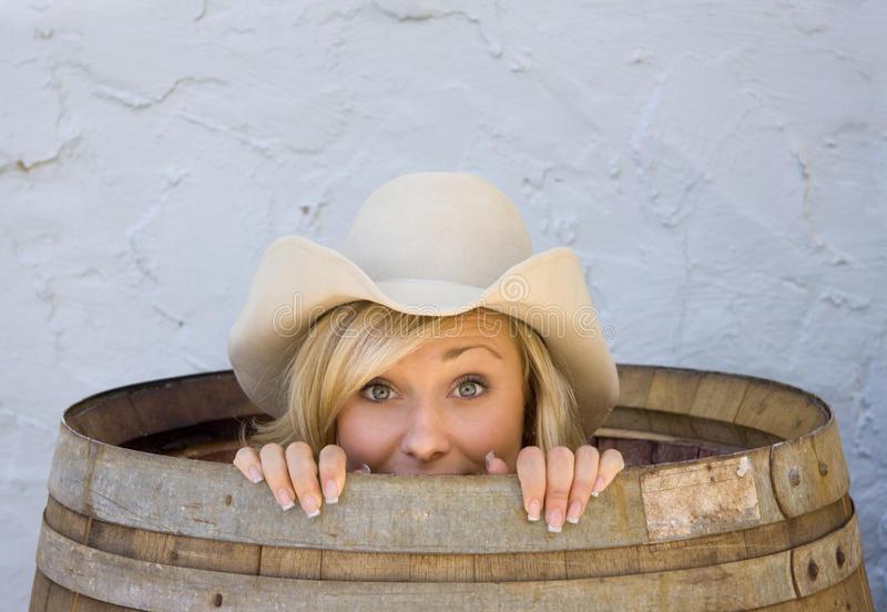 young-cowgirl-smiling-inside-barrel-1502