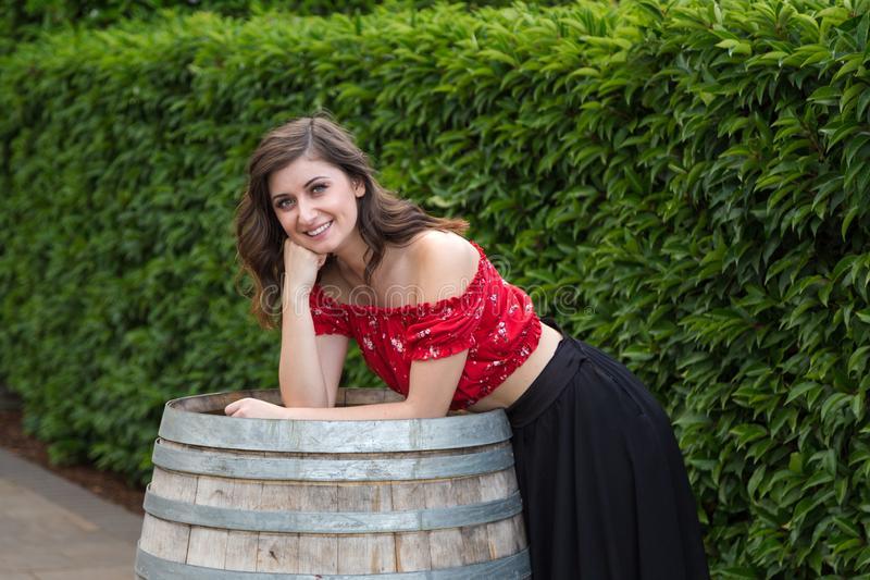 young-brunette-woman-summer-dress-wooden