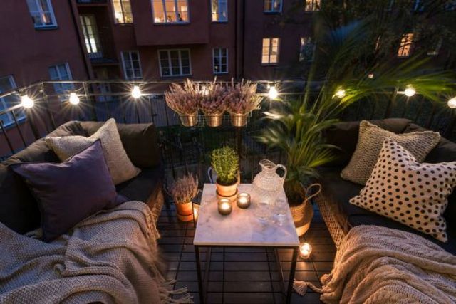 09-a-small-balcony-with-two-sofas-and-a-