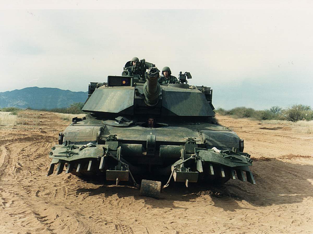 Abrams tank with mine plow
