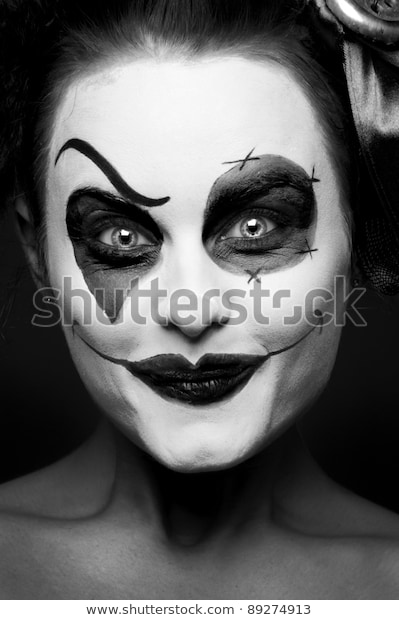 scary-female-clown-staring-dark-600w-892