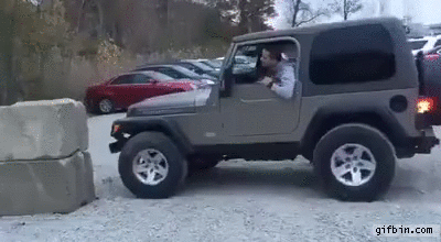 jeep tries to climb rock
