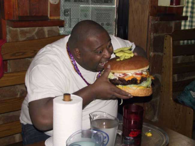 fat-black-guy-eating-giant-hamburger