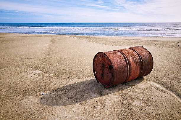rusted-old-barrel-on-sand-beach-picture-