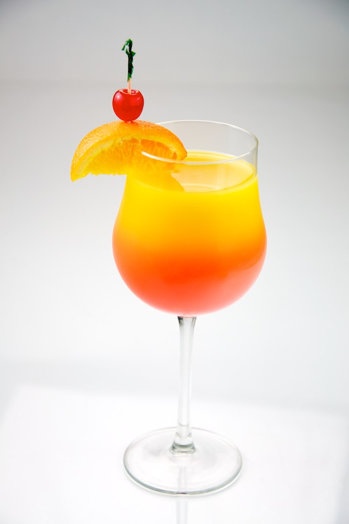 Tequila Sunrise garnished with orange an