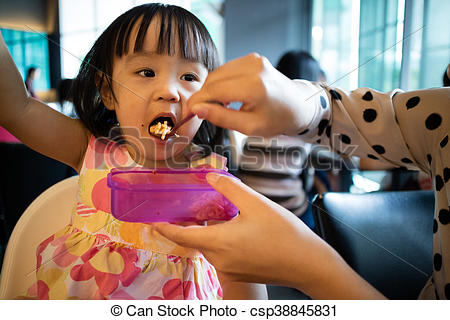 asian-mother-feeding-kid-daughter-food-s
