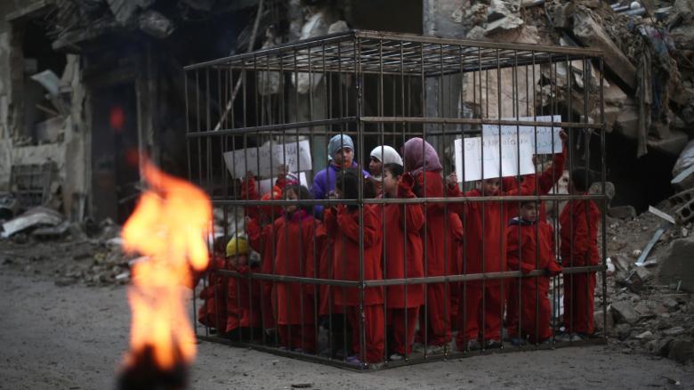 Syrian-children-wearing-orange-jumpsuits