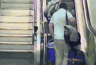 funny-gif-escalator-fall-bags-laying-dow