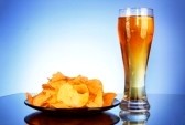 8514553-beer-and-potato-chips-on-blue-ba