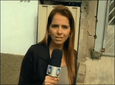 Woman-Tosses-Water-on-News-Reporter