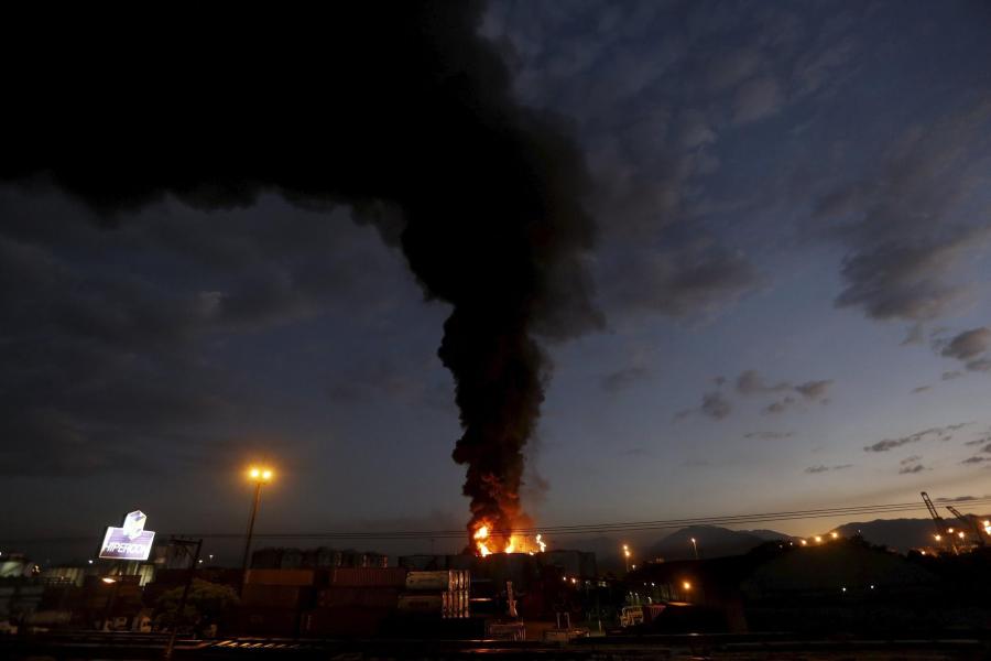 Smoke-rises-from-a-fire-at-a-fuel-tank-s