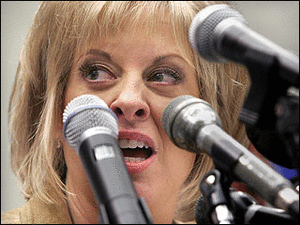 Nancy-Grace-In-Front-Of-Various-Phallic-