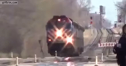 woman crosses train tracks