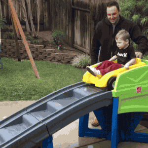 dad-push-kid-car-slide-wipeout