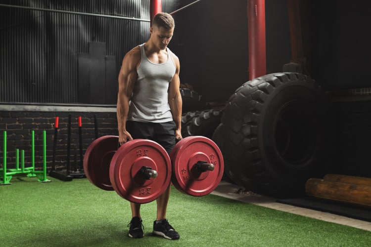 man-doing-farmers-walk-exercise