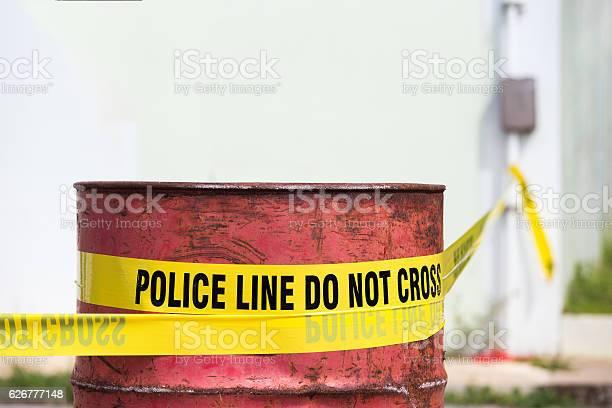 police-line-do-no-cross-with-red-barrel-