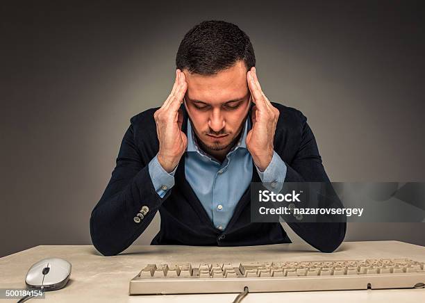 portrait-frustrated-young-man-hands-touc