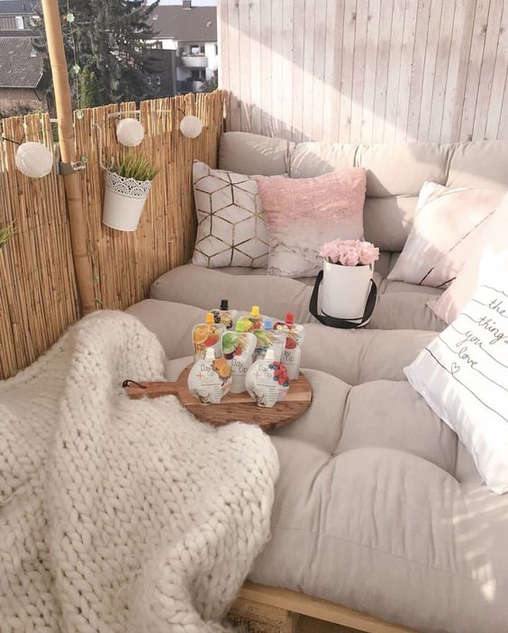 a-balcony-sleeping-space-with-a-bed-with