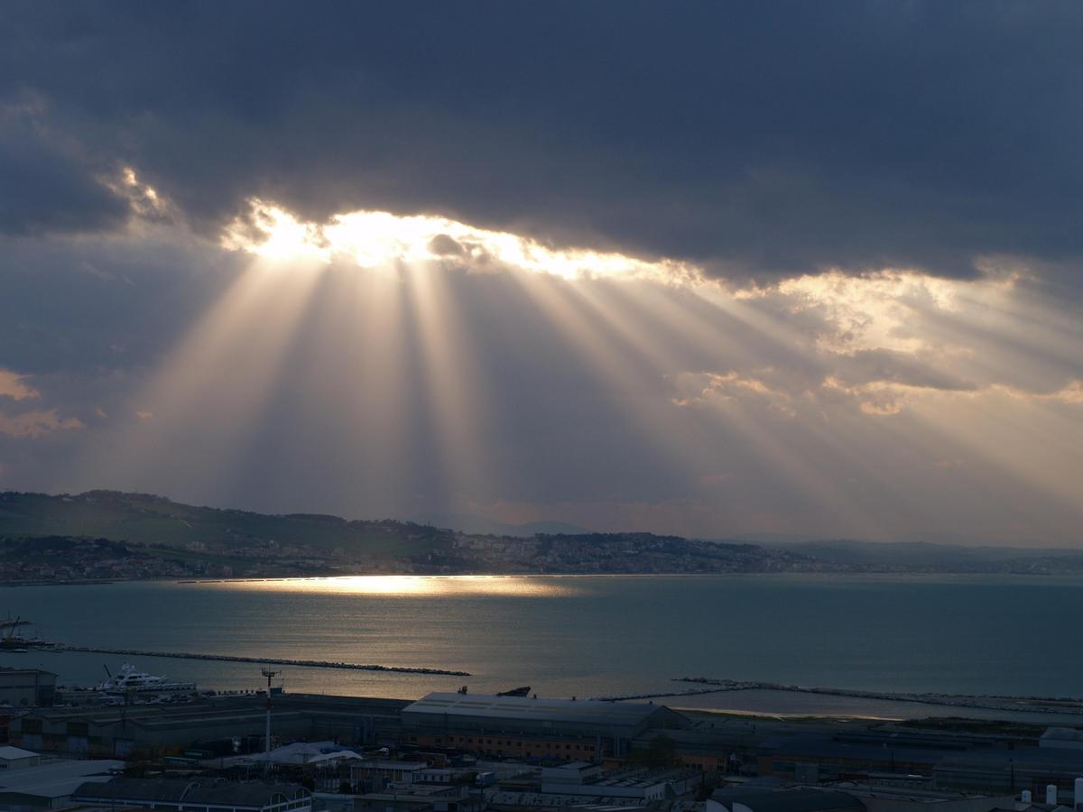 Flashes of sun between clouds and sea