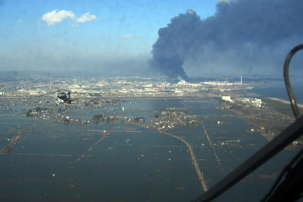 SH 60B helicopter flies over Sendai