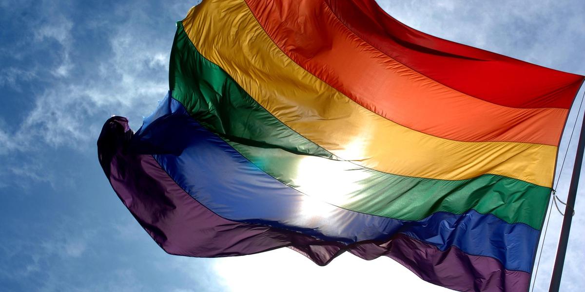 Rainbow flag and blue skies