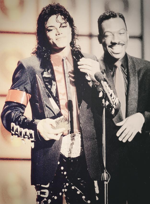 Accepting-an-award-with-Eddie-Murphy-mic