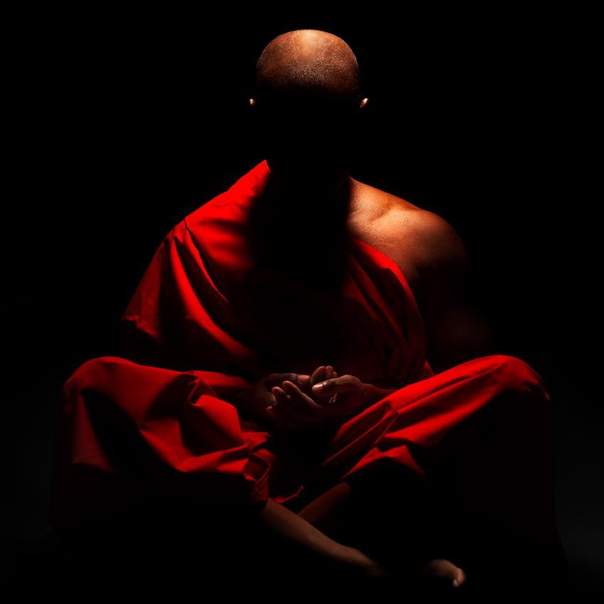 monk-meditating-in-dark