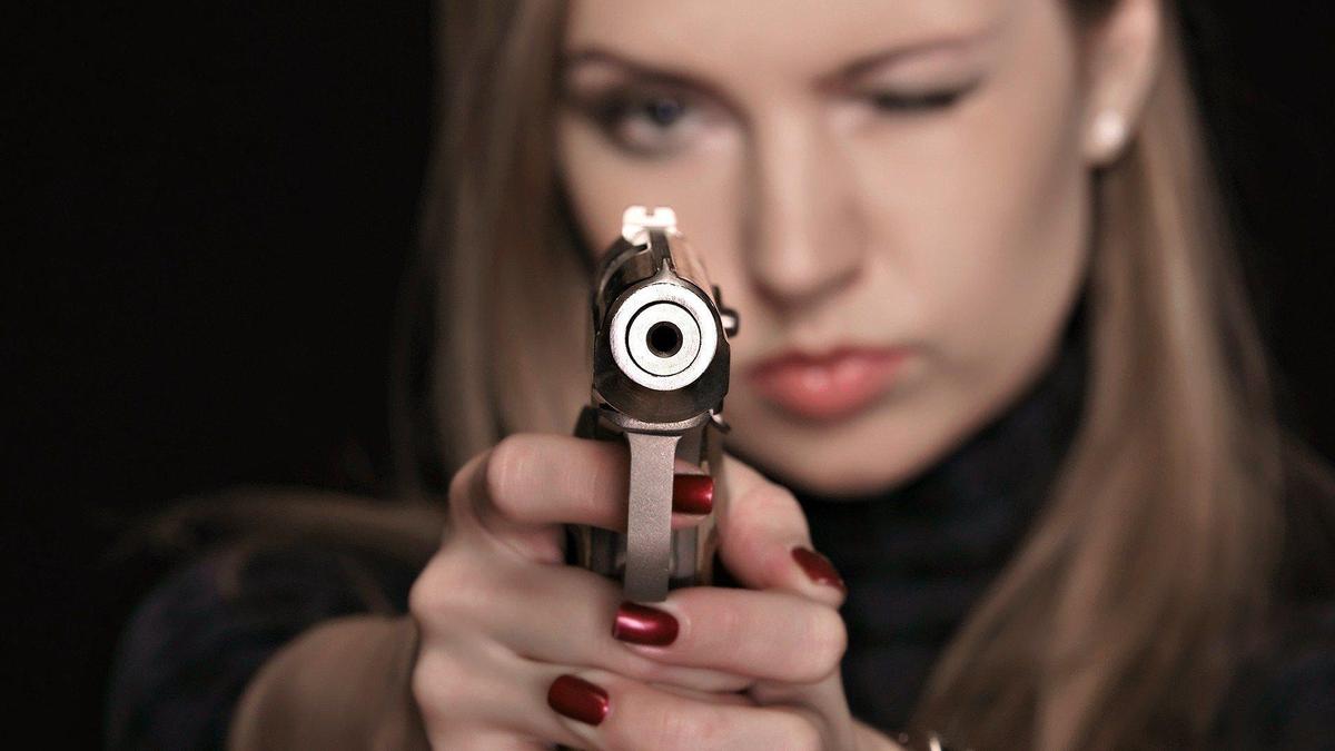 6948182-cool-girl-with-gun