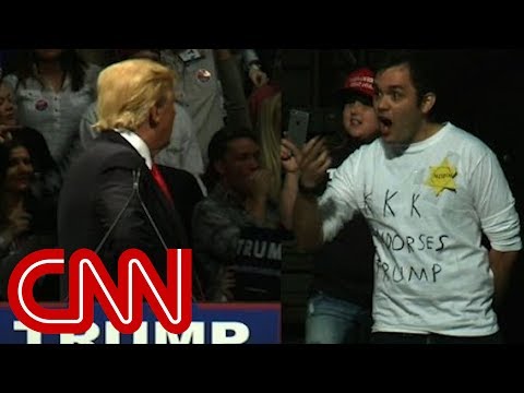 Youtube: Trump stares down man in 'KKK' shirt