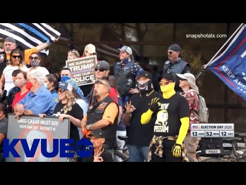 Youtube: Photos show Austin police with protesters gesturing 'white power' hand symbol | KVUE