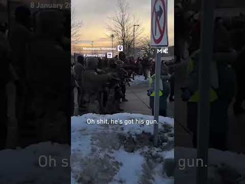 Youtube: Ice agent pulls gun on protester