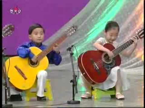 Youtube: North Korea Kindergarten children playing Guitar at Chongam Kindergarten