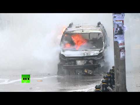 Youtube: Smoked Turkey: Police vehicles ablaze, black plumes over Taksim