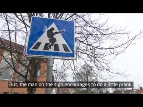 Youtube: Traffic sign makes people do the Monty Python Silly Walk