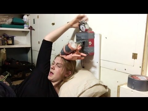 Youtube: Woman Gets Hair Caught in Alarm Clock She Invented To Slap Her Awake