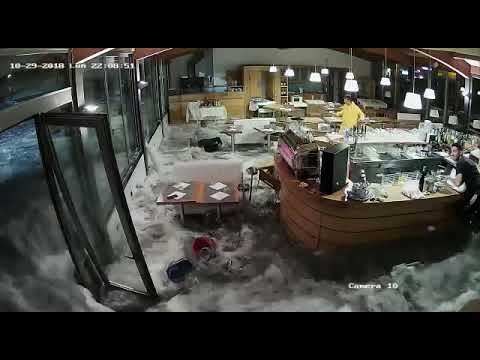 Youtube: Wave Crashes Through Windows of Italian Restaurant